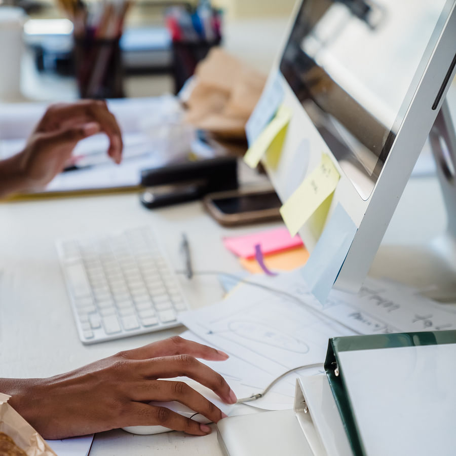 Wheelchair user comfortably using an accessible computer desk